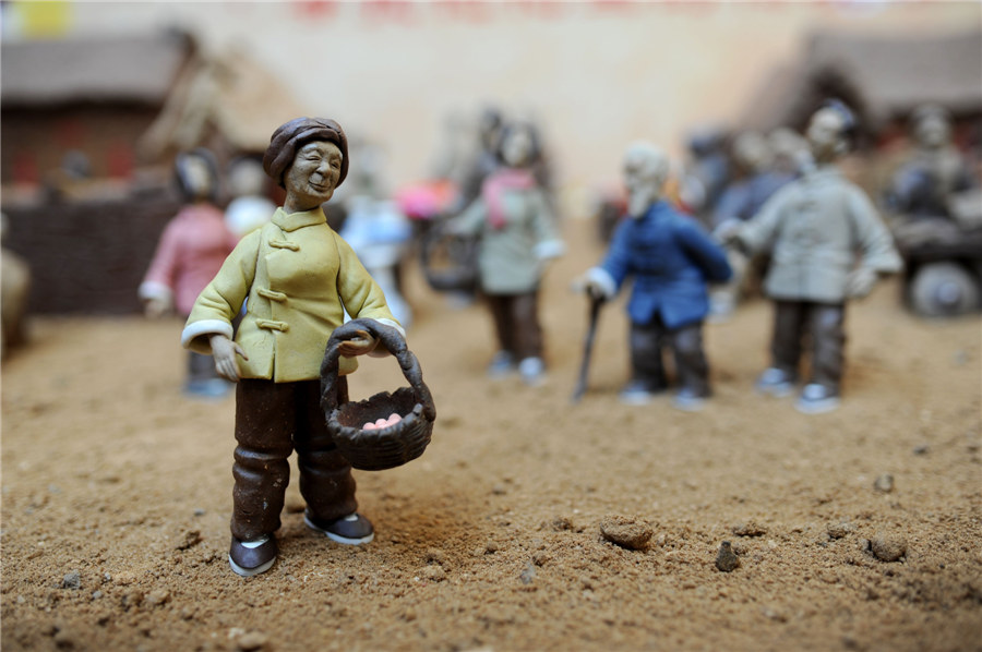 Estatuilla de?una mujer vendiendo huevos?hecha de arcilla.?[Fotografía?por?Wang?Haibin/Asianewsphoto]