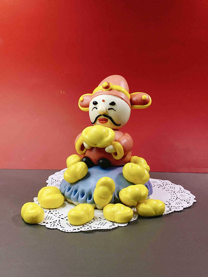 Ouyang Qinyun, una maestra de los “mantou” de Chongqing, ha creado una serie de bollos para celebrar el A?o Nuevo Chino. [Foto proporcionada a chinadaily.com.cn]